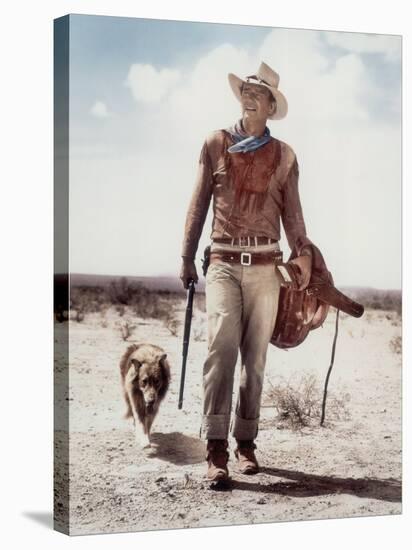 ca., 1953 --- Actor John Wayne on the movie set of "Hondo" (Hondo, L'Homme du Desert), directed by-null-Stretched Canvas