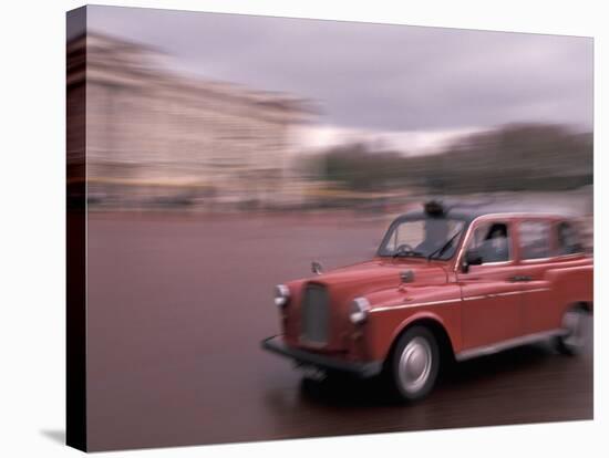 Cab racing past Buckingham Palace, London, England-Alan Klehr-Stretched Canvas