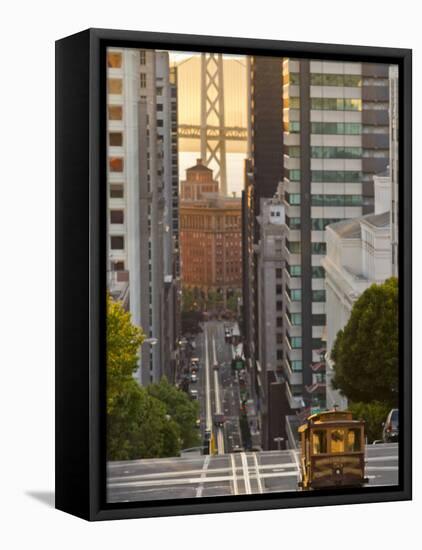 Cable Car Crossing California Street With Bay Bridge Backdrop in San Francisco, California, USA-Chuck Haney-Framed Stretched Canvas