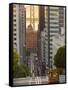 Cable Car Crossing California Street With Bay Bridge Backdrop in San Francisco, California, USA-Chuck Haney-Framed Stretched Canvas