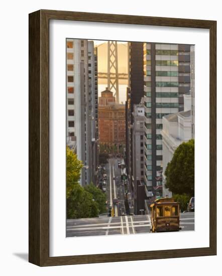 Cable Car Crossing California Street With Bay Bridge Backdrop in San Francisco, California, USA-Chuck Haney-Framed Photographic Print