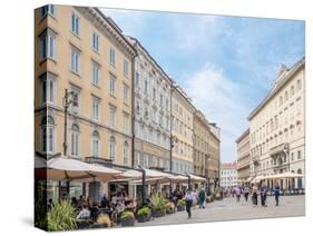 Cafe lined street, Trieste, Friuli Venezia Giulia, Italy, Europe-Jean Brooks-Stretched Canvas