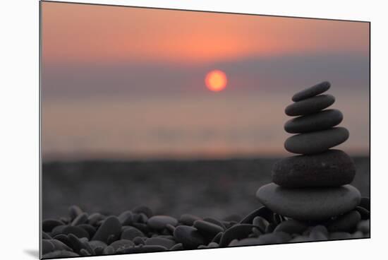 Cairn on the Beach in Front of the Rising Sun-Felix Strohbach-Mounted Photographic Print