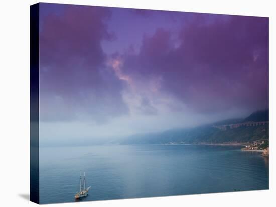 Calabrian Sunset and Sailboat, Strait of Messina, Scilla, Calabria, Italy-Walter Bibikow-Stretched Canvas