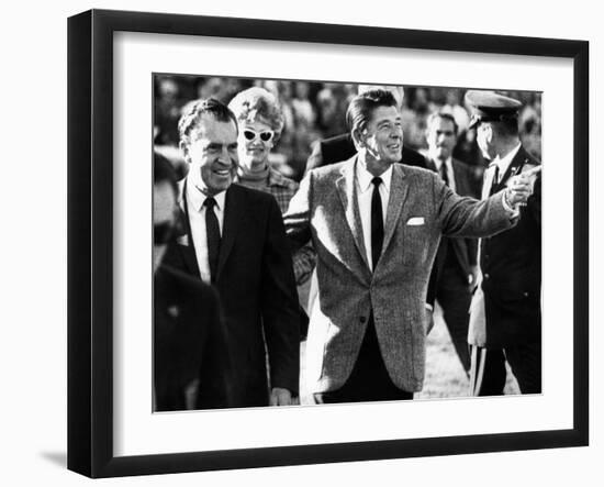 Calif Gov Ronald Reagan Escorts Pres-Elect Richard Nixon across Field at Halftime of Rose Bowl Game-null-Framed Photo