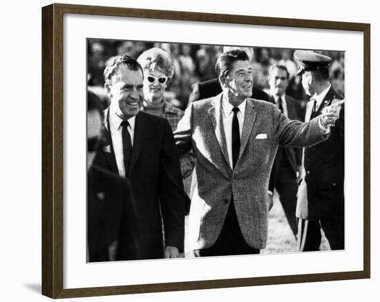 Calif Gov Ronald Reagan Escorts Pres-Elect Richard Nixon across Field at Halftime of Rose Bowl Game-null-Framed Photo