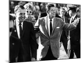 Calif Gov Ronald Reagan Escorts Pres-Elect Richard Nixon across Field at Halftime of Rose Bowl Game-null-Mounted Photo