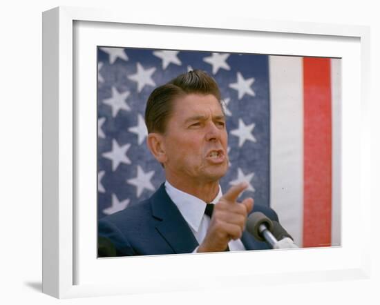 California Gubernatorial Candidate Ronald Reagan Speaking in Front of American Flag Backdrop-Bill Ray-Framed Photographic Print