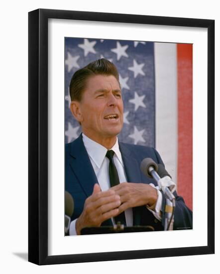 California Gubernatorial Candidate Ronald Reagan Speaking in Front of American Flag Backdrop-Bill Ray-Framed Photographic Print