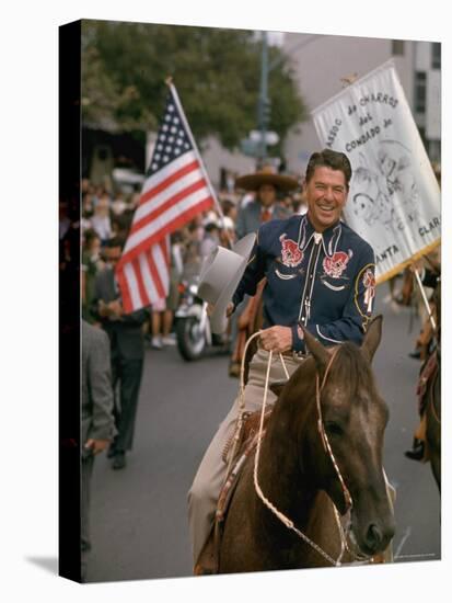 California Republican Gubernatorial Candidate Ronald Reagan, in Cowboy Attire, Riding Horse Outside-Bill Ray-Stretched Canvas