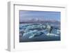 Calving icebergs in Jokulsarlon Glacier Lagoon in south Iceland-Chuck Haney-Framed Photographic Print