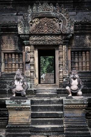 https://imgc.allpostersimages.com/img/posters/cambodia-angkor-wat-banteay-srei-temple-monkey-statues-and-doorway_u-L-PRPYBS0.jpg?artPerspective=n