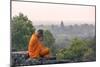 Cambodia, Siem Reap, Angkor Wat Complex. Monk Meditating with Angor Wat Temple in the Background-Matteo Colombo-Mounted Photographic Print