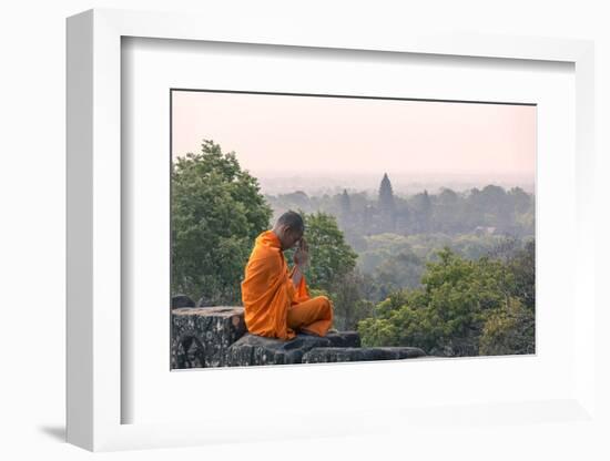 Cambodia, Siem Reap, Angkor Wat Complex. Monk Meditating with Angor Wat Temple in the Background-Matteo Colombo-Framed Photographic Print