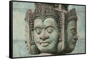 Cambodia, Siem Reap, carved statues at Buddhist temple.-Merrill Images-Framed Stretched Canvas