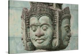 Cambodia, Siem Reap, carved statues at Buddhist temple.-Merrill Images-Stretched Canvas