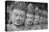 Cambodia, Siem Reap, carved statues at Buddhist temple.-Merrill Images-Stretched Canvas