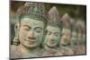 Cambodia, Siem Reap, carved statues at Buddhist temple.-Merrill Images-Mounted Photographic Print