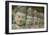 Cambodia, Siem Reap, carved statues at Buddhist temple.-Merrill Images-Framed Photographic Print