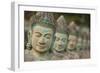 Cambodia, Siem Reap, carved statues at Buddhist temple.-Merrill Images-Framed Photographic Print