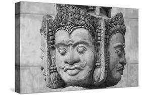 Cambodia, Siem Reap, carved statues at Buddhist temple.-Merrill Images-Stretched Canvas