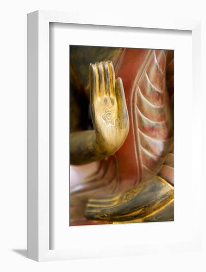 Cambodia, Siem Reap, golden hands on red wood statue of Buddha.-Merrill Images-Framed Photographic Print