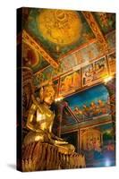 Cambodia. Wat Phnom is the cities highest point in Phnom Penh. Statues inside the temple.-Micah Wright-Stretched Canvas