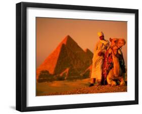 Camel and Driver Resting near the Great Pyramids, Egypt-Alexander Nesbitt-Framed Premium Photographic Print