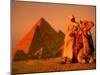 Camel and Driver Resting near the Great Pyramids, Egypt-Alexander Nesbitt-Mounted Premium Photographic Print