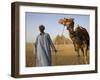 Camel Driver Stands in Front of the Pyramids at Giza, Egypt-Julian Love-Framed Photographic Print