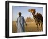 Camel Driver Stands in Front of the Pyramids at Giza, Egypt-Julian Love-Framed Photographic Print