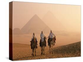 Camel Riders at Giza Pyramids, UNESCO World Heritage Site, Giza, Cairo, Egypt, North Africa, Africa-null-Stretched Canvas