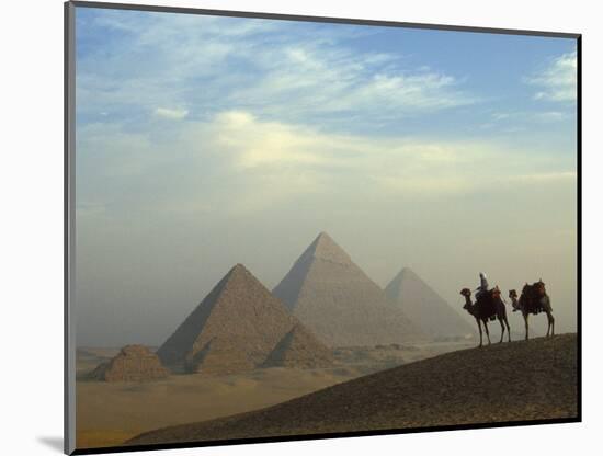Camels and Driver at the Pyramids Complex, Egypt-Claudia Adams-Mounted Photographic Print