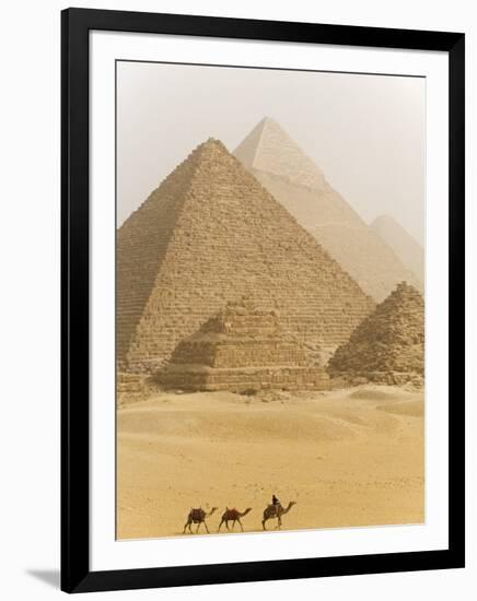 Camels Pass in Front of the Pyramids at Giza, Egypt-Julian Love-Framed Photographic Print