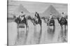 Camels with Native Riders on Board Stand in Reflective Floodwaters-null-Stretched Canvas