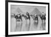 Camels with Native Riders on Board Stand in Reflective Floodwaters-null-Framed Premium Giclee Print