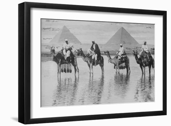 Camels with Native Riders on Board Stand in Reflective Floodwaters-null-Framed Art Print