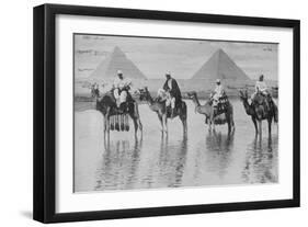 Camels with Native Riders on Board Stand in Reflective Floodwaters-null-Framed Art Print