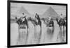 Camels with Native Riders on Board Stand in Reflective Floodwaters-null-Framed Art Print