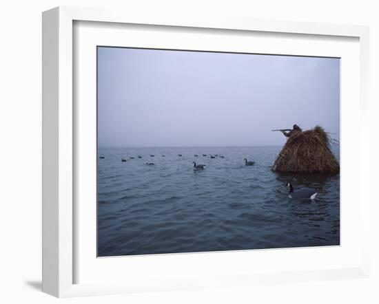 Camouflaged Hunter Shooting Ducks-null-Framed Premium Photographic Print