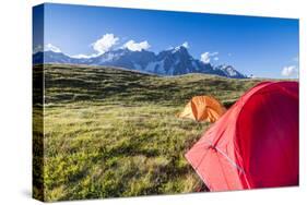 Camping tents in the green meadows with Mont De La Saxe in the background, Courmayeur, Aosta Valley-Roberto Moiola-Stretched Canvas