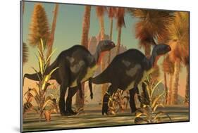 Camptosaurus Dinosaurs Wander Through a Prehistoric Jungle-null-Mounted Premium Giclee Print