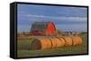 Canada, Alberta, Grande Prairie. Red Barn and Hay Bales at Sunset-Jaynes Gallery-Framed Stretched Canvas