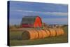 Canada, Alberta, Grande Prairie. Red Barn and Hay Bales at Sunset-Jaynes Gallery-Stretched Canvas