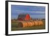 Canada, Alberta, Grande Prairie. Red Barn and Hay Bales at Sunset-Jaynes Gallery-Framed Photographic Print