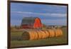 Canada, Alberta, Grande Prairie. Red Barn and Hay Bales at Sunset-Jaynes Gallery-Framed Photographic Print