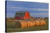 Canada, Alberta, Grande Prairie. Red Barn and Hay Bales at Sunset-Jaynes Gallery-Stretched Canvas