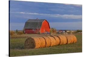 Canada, Alberta, Grande Prairie. Red Barn and Hay Bales at Sunset-Jaynes Gallery-Stretched Canvas