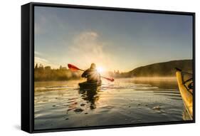 Canada, British Columbia. A kayaker paddles in morning mist on a Canadian lake.-Gary Luhm-Framed Stretched Canvas