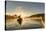 Canada, British Columbia. A kayaker paddles in morning mist on a Canadian lake.-Gary Luhm-Stretched Canvas
